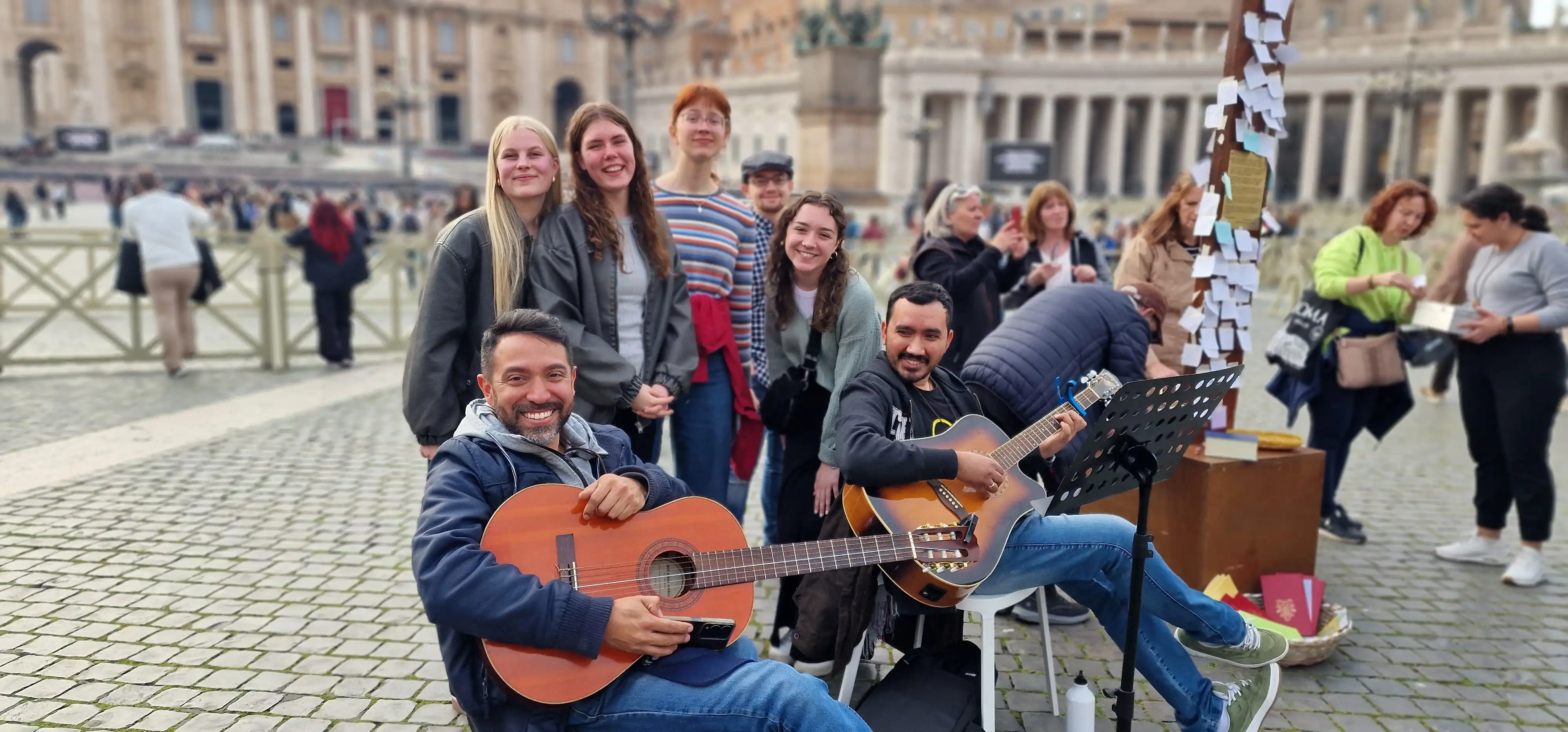 Group playing guitar together
